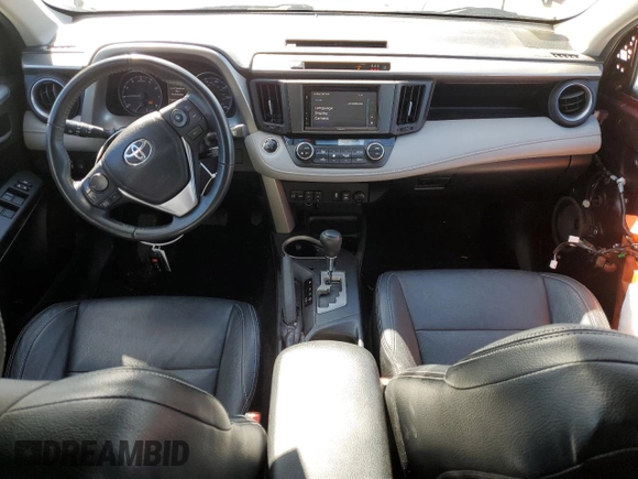 2018 Toyota RAV4 XLE with VIN 2T3RFREVXJW715931, listed as a Copart auction lot 48130715 with 106,324 mi miles and Salvage Title. Bid and sale history available at DreamBid. Image 8.