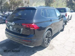 2021 Volkswagen Tiguan SE with VIN 3VV3B7AX0MM015825, listed as a IAAI auction lot 41955268 with 57,909 mi miles and . Bid and sale history available at DreamBid. Image 4.