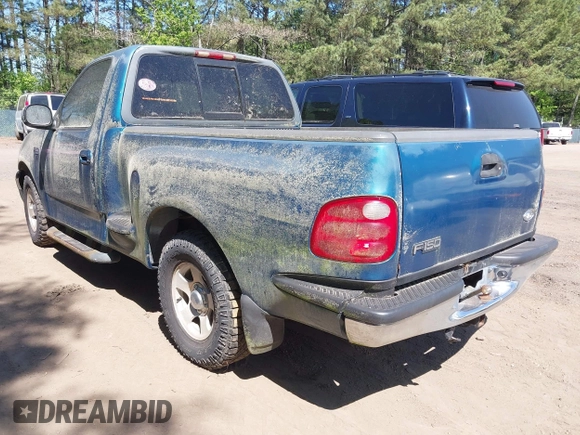 2000 Ford F-150 XL with VIN 1FTZF0722YKB38958, listed as a IAAI auction lot 42050827 with 235,315 mi miles. Bid and sale history available at carsss.com. Image 3.