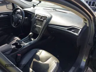2014 Ford Fusion Titanium with VIN 3FA6P0K90ER358536, listed as a IAAI auction lot 41931474 with 170,856 mi miles. Bid and sale history available at carsss.com. Image 5.