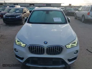 2016 BMW X1 xDrive28i with VIN WBXHT3C3XGP889461, listed as a IAAI auction lot 41757627 with 105,681 mi miles. Bid and sale history available at carsss.com. Image 12.