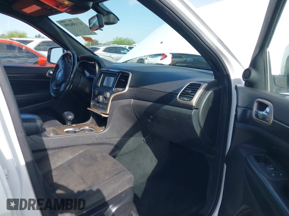 2014 Jeep Grand Cherokee Laredo with VIN 1C4RJEAG3EC125478, listed as a IAAI auction lot 41938499 with 167,588 mi miles and . Bid and sale history available at DreamBid. Image 5.