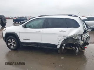 2015 Jeep Cherokee Trailhawk with VIN 1C4PJMBB1FW630519, listed as a IAAI auction lot 41605466 with 219,390 mi miles and . Bid and sale history available at carsss.com. Image 15.