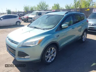 2013 Ford Escape SEL with VIN 1FMCU9HX4DUB95893, listed as a IAAI auction lot 42167435 with 142,016 mi miles. Bid and sale history available at carsss.com. Image 2.