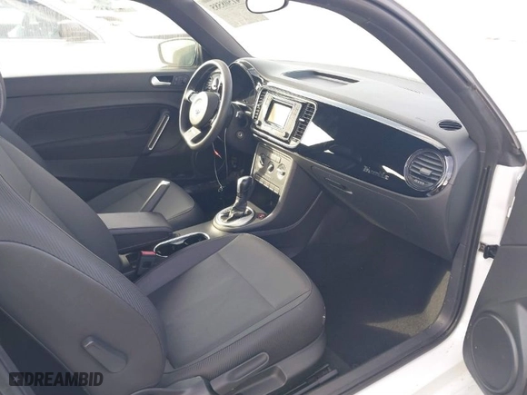 2016 Volkswagen Beetle Coupe 1.8T Wolfsburg Edition with VIN 3VWF17AT0GM607755, listed as a IAAI auction lot 41508585 with 52,913 mi miles. Bid and sale history available at carsss.com. Image 5.