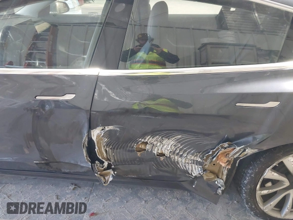 2018 Tesla Model 3 Long Range Battery with VIN 5YJ3E1EB1JF145520, listed as a IAAI auction lot 41360939 with 95,010 mi miles and . Bid and sale history available at DreamBid. Image 6.
