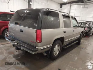 1999 GMC Yukon with VIN 1GKEK13R7XJ723255, listed as a IAAI auction lot 41879617 with 148,324 mi miles. Bid and sale history available at carsss.com. Image 4.