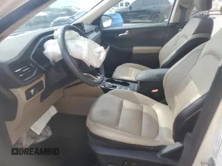 2020 Ford Escape Titanium z VIN 1FMCU9J9XLUB57675, wystawiony jako Copart lot #57777795 z przebiegiem Nie podano mil oraz Szkoda całkowita • Salvage title. Historia ofert i sprzedaży dostępna na DreamBid. Obrazek 7.