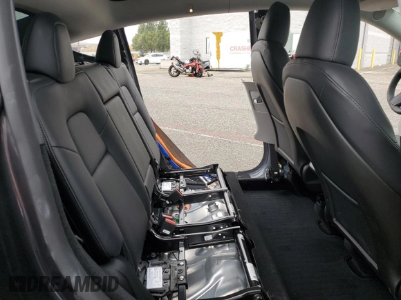 2024 Tesla Model Y with VIN 7SAYGDED5RF093410, listed as a Copart auction lot 50557225 with 6,396 mi miles and Salvage Title. Bid and sale history available at DreamBid. Image 12.