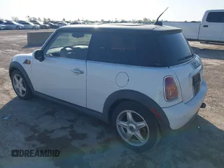 2009 MINI Cooper Hardtop with VIN WMWMF33569TZ20989, listed as a IAAI auction lot 41994772 with 152,944 mi miles. Bid and sale history available at carsss.com. Image 3.