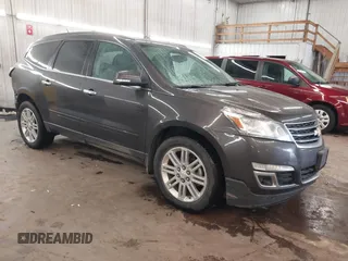 2015 Chevrolet Traverse LT z VIN 1GNKVGKD5FJ296064, wystawiony jako IAAI lot #42581755 z przebiegiem 162 297 mil mil oraz . Historia ofert i sprzedaży dostępna na DreamBid. Obrazek 1.