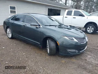 2015 Lincoln MKZ z VIN 3LN6L2J90FR616800, wystawiony jako IAAI lot #41683401 z przebiegiem 92 239 mil mil oraz . Historia ofert i sprzedaży dostępna na DreamBid. Obrazek 1.