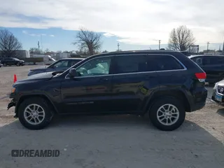 2018 Jeep Grand Cherokee Laredo E with VIN 1C4RJFAG7JC244103, listed as a IAAI auction lot 41260642 with 116,797 mi miles. Bid and sale history available at carsss.com. Image 14.