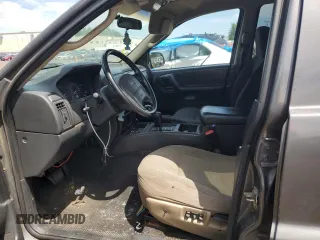 2004 Jeep Grand Cherokee Laredo with VIN 1J4GW48S64C291404, listed as a Copart auction lot 62835335 with 170,365 mi miles and Salvage title. Bid and sale history available at DreamBid. Image 7.