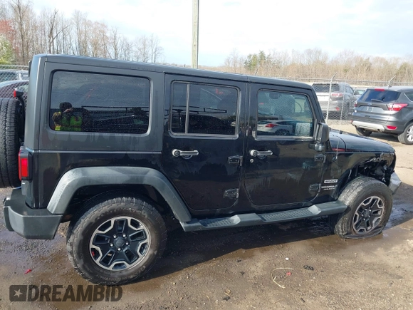 2013 Jeep Wrangler Unlimited Freedom z VIN 1C4BJWDG8DL648870, wystawiony jako IAAI lot #41909372 z przebiegiem 184 203 mil mil oraz . Historia ofert i sprzedaży dostępna na DreamBid. Obrazek 13.