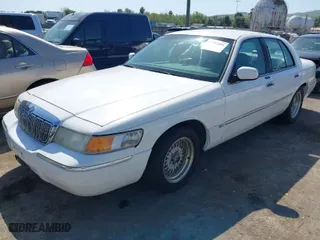 1998 Mercury Grand Marquis LS with VIN 2MEFM75W1WX629909, listed as a IAAI auction lot 41992694 with 105,426 mi miles. Bid and sale history available at carsss.com. Image 2.