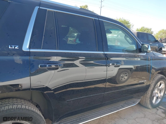 2015 Chevrolet Tahoe LTZ with VIN 1GNSCCKCXFR117525, listed as a IAAI auction lot 41839259 with 143,413 mi miles. Bid and sale history available at carsss.com. Image 14.