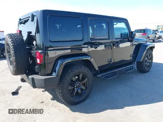 2014 Jeep Wrangler Unlimited Sahara with VIN 1C4BJWEG0EL306202, listed as a IAAI auction lot 41784330 with 79,123 mi miles. Bid and sale history available at carsss.com. Image 4.