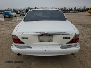 1998 Jaguar XJ with VIN SAJHX1248WC835728, listed as a Copart auction lot 86698244 with 116,768 mi miles and Clean title. Bid and sale history available at DreamBid. Image 6.