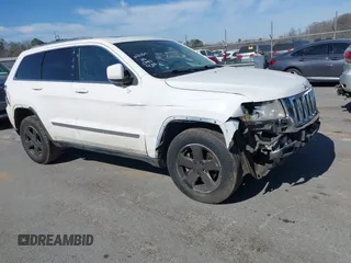 2012 Jeep Grand Cherokee Laredo with VIN 1C4RJFAT4CC229204, listed as a IAAI auction lot 41659491 with 141,143 mi miles. Bid and sale history available at carsss.com. Image 1.