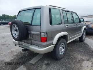 2002 Isuzu Trooper S with VIN JACDJ58X527J07745, listed as a IAAI auction lot 42714673 with 122,482 mi miles and . Bid and sale history available at DreamBid. Image 4.