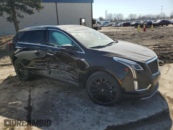 2022 Cadillac XT5 AWD Premium Luxury with VIN 1GYKNDRS7NZ164512, listed as a Copart auction lot 49236945 with 30,019 mi miles and Salvage title. Bid and sale history available at DreamBid. Image 4.