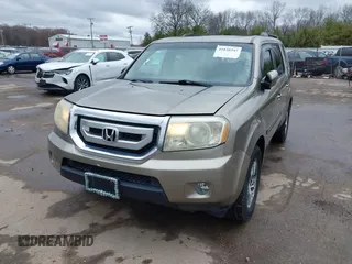 2009 Honda Pilot EX-L with VIN 5FNYF48569B002035, listed as a IAAI auction lot 41838347 with 198,849 mi miles. Bid and sale history available at carsss.com. Image 2.
