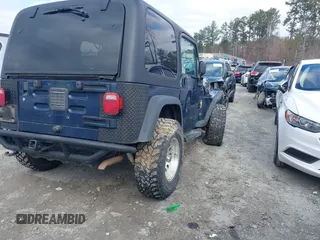 2006 Jeep Wrangler Sport with VIN 1J4FA49S66P732419, listed as a IAAI auction lot 41607851 with 120,099 mi miles. Bid and sale history available at carsss.com. Image 4.