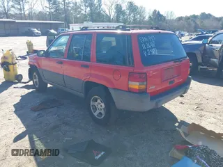 1996 Jeep Grand Cherokee Laredo with VIN 1J4EX58S8TC122302, listed as a IAAI auction lot 41218573 with 195,392 mi miles. Bid and sale history available at carsss.com. Image 3.