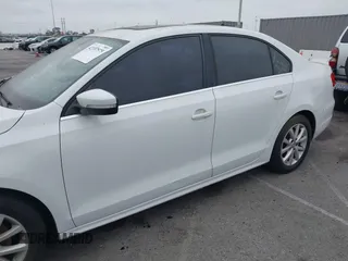 2014 Volkswagen Jetta Sedan SE w/Connectivity/Sunroof PZEV with VIN 3VWD17AJ6EM420961, listed as a IAAI auction lot 42107575 with 198,329 mi miles. Bid and sale history available at carsss.com. Image 6.