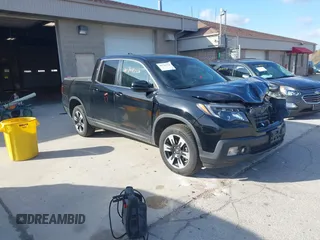 2020 Honda Ridgeline RTL with VIN 5FPYK3F59LB023212, listed as a IAAI auction lot 40704228 with 73,259 mi miles and . Bid and sale history available at DreamBid. Image 1.