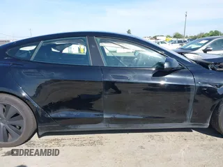 2023 Tesla Model S with VIN 5YJSA1E54PF531021, listed as a IAAI auction lot 42014104 with Not provided miles and . Bid and sale history available at DreamBid. Image 13.