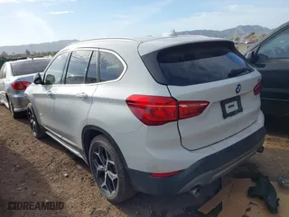 2018 BMW X1 sDrive28i with VIN WBXHU7C32J5H41587, listed as a IAAI auction lot 41538394 with 125,804 mi miles. Bid and sale history available at carsss.com. Image 3.