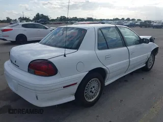 1997 Pontiac Grand Am SE with VIN 1G2NE52T3VC809661, listed as a IAAI auction lot 41100711 with 168,686 mi miles. Bid and sale history available at carsss.com. Image 4.