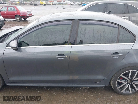 2014 Volkswagen Jetta GLI z VIN 3VW4T7AJ2EM208598, wystawiony jako IAAI lot #42381855 z przebiegiem 82 761 mil mil oraz . Historia ofert i sprzedaży dostępna na DreamBid. Obrazek 14.