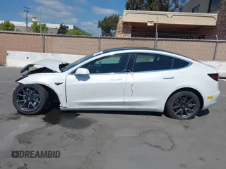 2020 Tesla Model 3 Standard Range Plus with VIN 5YJ3E1EAXLF590591, listed as a IAAI auction lot 42140338 with 79,342 mi miles and . Bid and sale history available at DreamBid. Image 15.