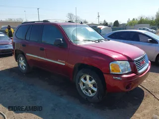 2006 GMC Envoy SLT with VIN 1GKDT13S662189377, listed as a IAAI auction lot 42106602 with 156,391 mi miles. Bid and sale history available at carsss.com. Image 1.