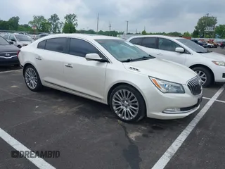 2014 Buick LaCrosse Premium II with VIN 1G4GF5G34EF197457, listed as a IAAI auction lot 42276703 with 130,671 mi miles and . Bid and sale history available at DreamBid. Image 1.
