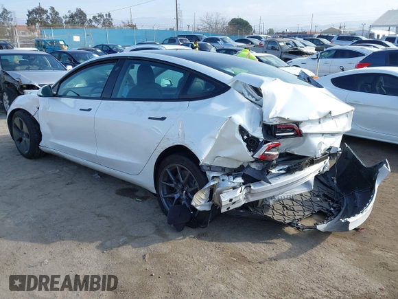 2022 Tesla Model 3 with VIN 5YJ3E1EA1NF167711, listed as a IAAI auction lot 41594266 with 50,554 mi miles and . Bid and sale history available at DreamBid. Image 3.