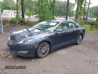 2013 Lincoln MKZ with VIN 3LN6L2J98DR817275, listed as a IAAI auction lot 42196186 with 128,456 mi miles. Bid and sale history available at carsss.com. Image 2.