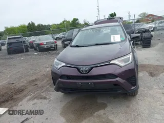 2018 Toyota RAV4 LE with VIN 2T3BFREV9JW771845, listed as a IAAI auction lot 42108641 with 127,394 mi miles. Bid and sale history available at carsss.com. Image 13.