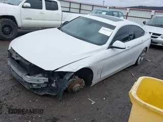 2016 BMW 4 Series 428i xDrive with VIN WBA4C9C54GG135615, listed as a IAAI auction lot 41655368 with 156,851 mi miles and . Bid and sale history available at carsss.com. Image 2.
