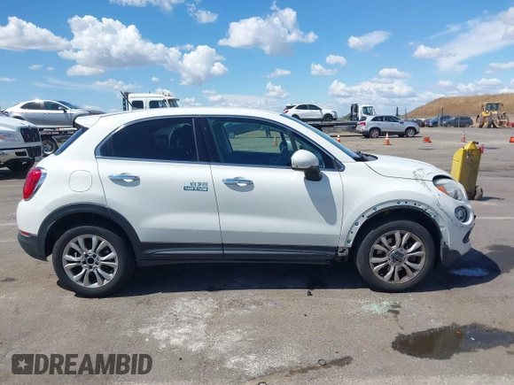2016 FIAT 500X Lounge z VIN ZFBCFXDT0GP333273, wystawiony jako IAAI lot #42269130 z przebiegiem 98 707 mil mil oraz . Historia ofert i sprzedaży dostępna na DreamBid. Obrazek 13.