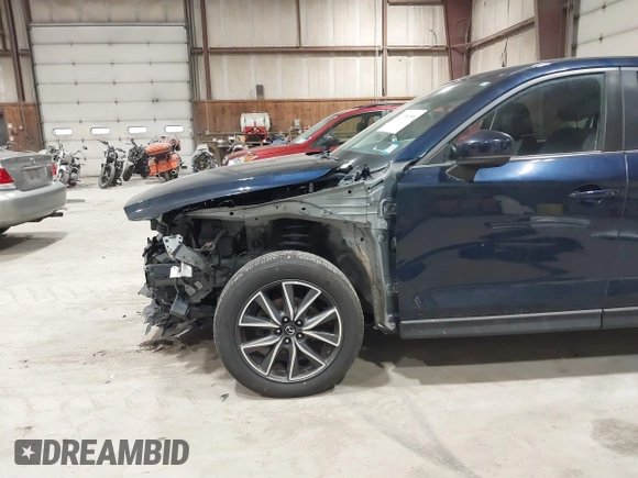 2018 Mazda CX-5 Touring with VIN JM3KFBCM5J0434716, listed as a IAAI auction lot 41738956 with 108,264 mi miles and . Bid and sale history available at DreamBid. Image 6.