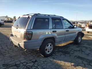 1999 Jeep Grand Cherokee Laredo with VIN 1J4GW58NXXC747537, listed as a Copart auction lot 87310234 with 0 mi miles and Salvage Title. Bid and sale history available at carsss.com. Image 3.