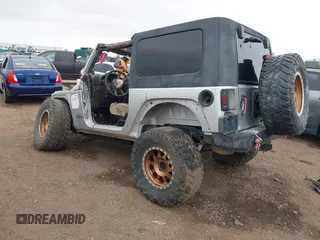 2009 Jeep Wrangler X with VIN 1J4FA24149L775557, listed as a IAAI auction lot 42363653 with Not provided miles and . Bid and sale history available at DreamBid. Image 3.
