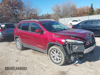 2014 Jeep Cherokee Latitude with VIN 1C4PJMCS4EW260373, listed as a IAAI auction lot 41027590 with 115,064 mi miles. Bid and sale history available at carsss.com. Image 1.