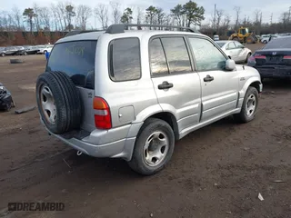 2002 Suzuki Grand Vitara JLX with VIN JS3TD62V724153257, listed as a IAAI auction lot 41452635 with 999,999 mi miles. Bid and sale history available at carsss.com. Image 4.