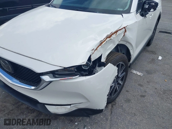 2018 Mazda CX-5 Touring z VIN JM3KFACM6J1419663, wystawiony jako IAAI lot #41879677 z przebiegiem 115 224 mil mil oraz . Historia ofert i sprzedaży dostępna na DreamBid. Obrazek 17.