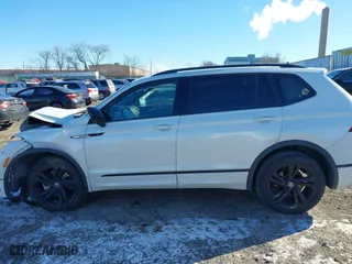 2023 Volkswagen Tiguan SE R-Line Black with VIN 3VVCB7AX8PM141998, listed as a IAAI auction lot 41278010 with 230,000 mi miles. Bid and sale history available at carsss.com. Image 15.